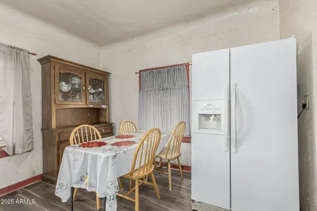 a view of a dining room with furniture and a window