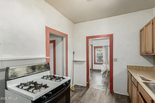 a view of a kitchen counter space and wooden floor