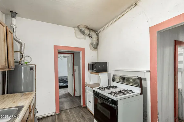 a kitchen with stainless steel appliances granite countertop a stove and a refrigerator