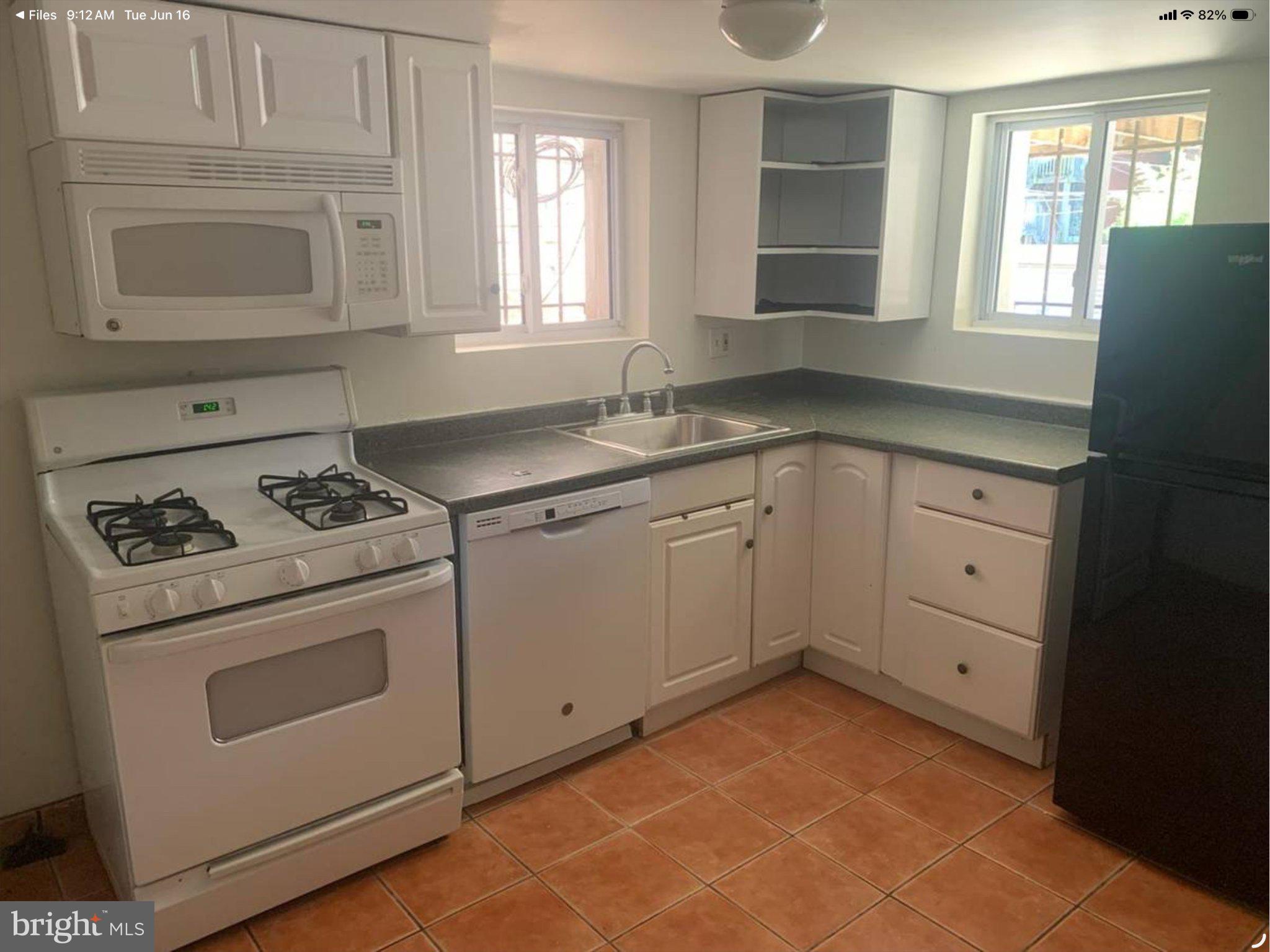 1250 Columbia Road Northwest Washington, DC 20009 - Photo 5 of 11 Full kitchen with all the appliances