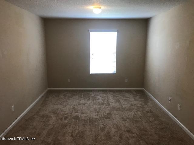 16498 Tisons Bluff Road Jacksonville, FL 32218 - Photo 20 of 37 a view of an empty room with a window