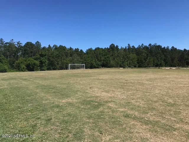 16498 Tisons Bluff Road Jacksonville, FL 32218 - Photo 30 of 37 a view of an outdoor space and a yard