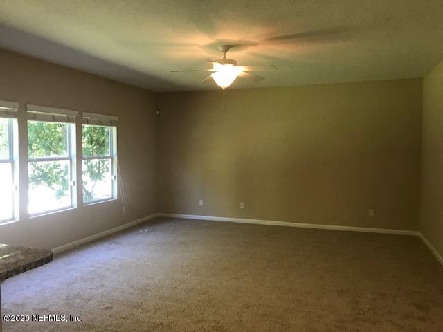 16498 Tisons Bluff Road Jacksonville, FL 32218 - Photo 7 of 37 an empty room with a empty space and windows