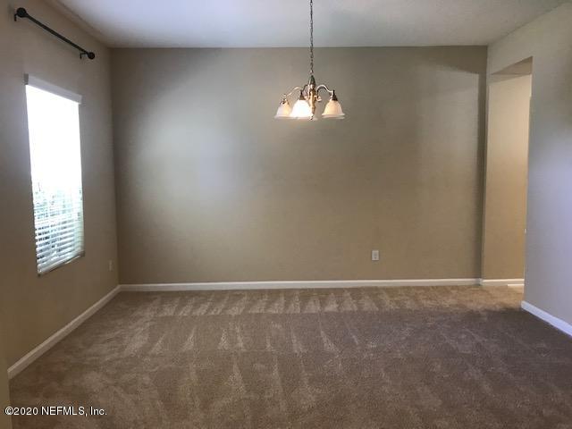 16498 Tisons Bluff Road Jacksonville, FL 32218 - Photo 8 of 37 a view of an empty room with a window