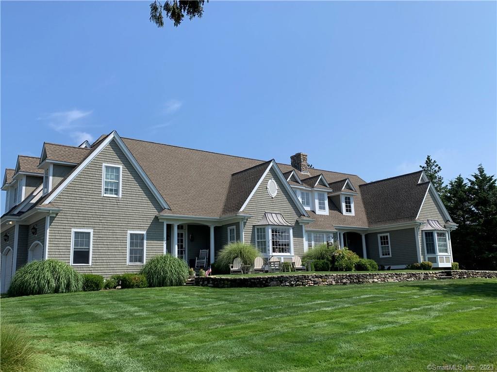 199 Falcon Road Guilford, CT 06437 - Photo 1 of 1 a front view of a house with a garden