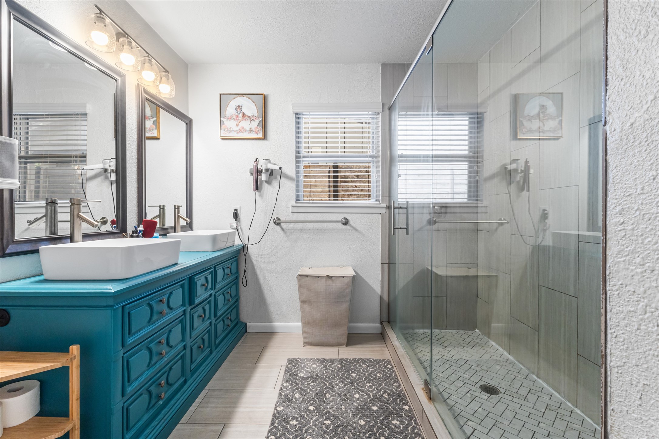 405 West 17th Street Georgetown, TX 78626 - Photo 12 of 21 a bathroom with a double vanity sink a toilet and a shower