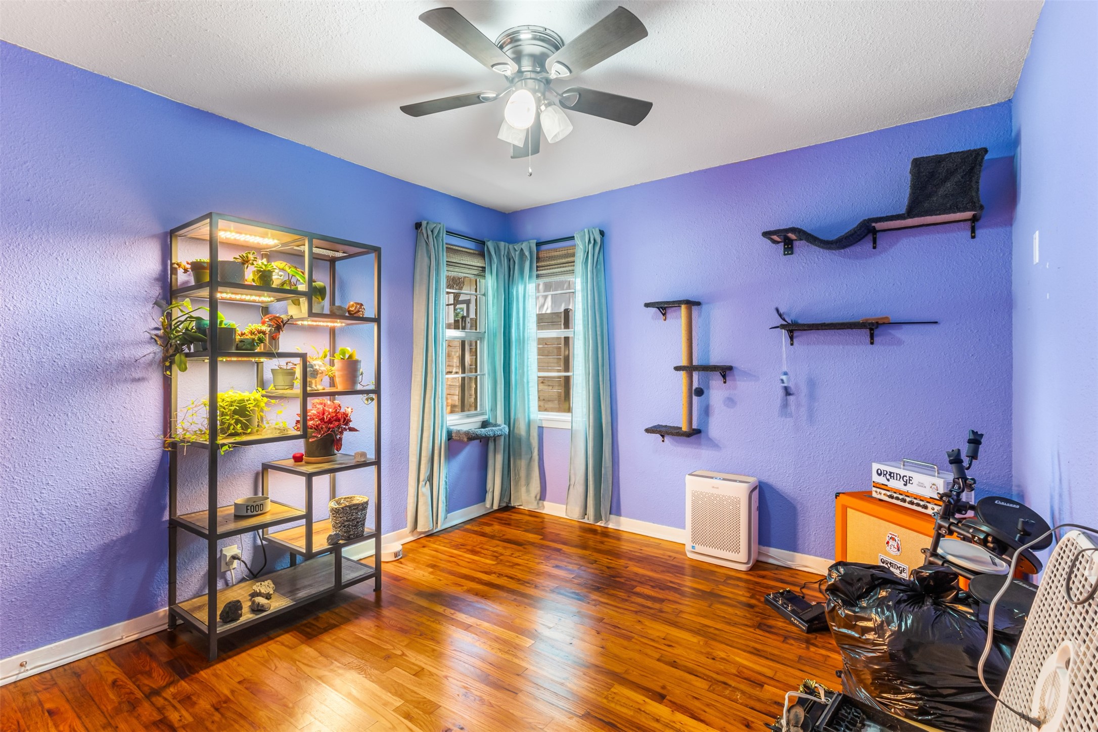405 West 17th Street Georgetown, TX 78626 - Photo 14 of 21 a bed room with a bed and a chandelier