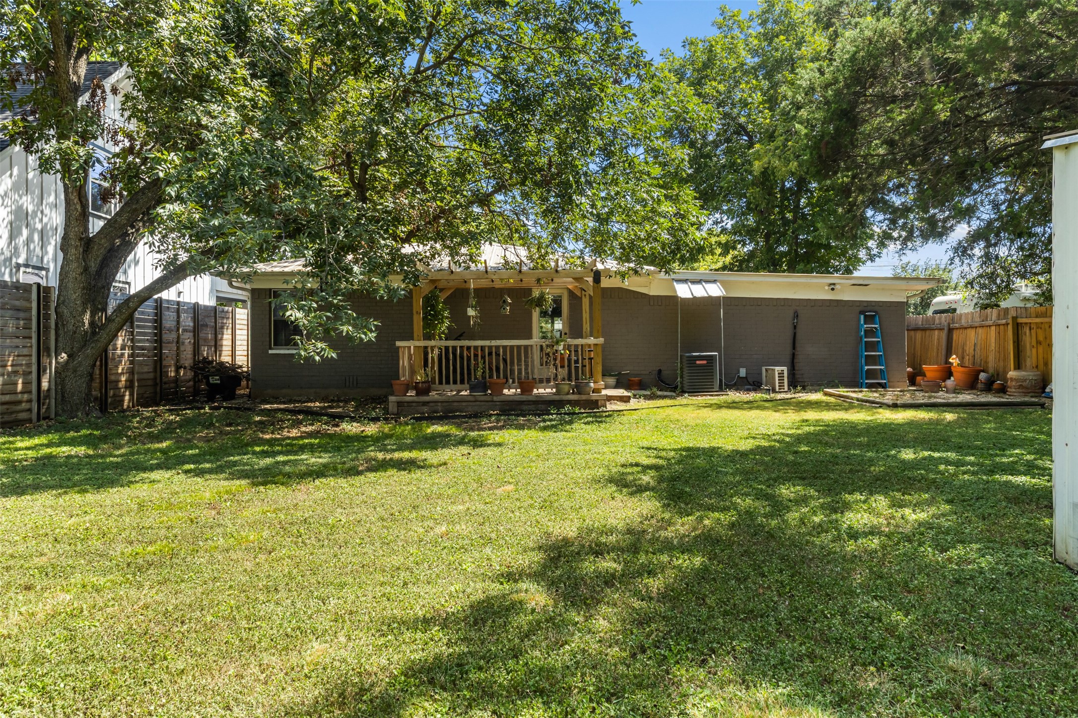 405 West 17th Street Georgetown, TX 78626 - Photo 18 of 21 a front view of a house with a yard and trees