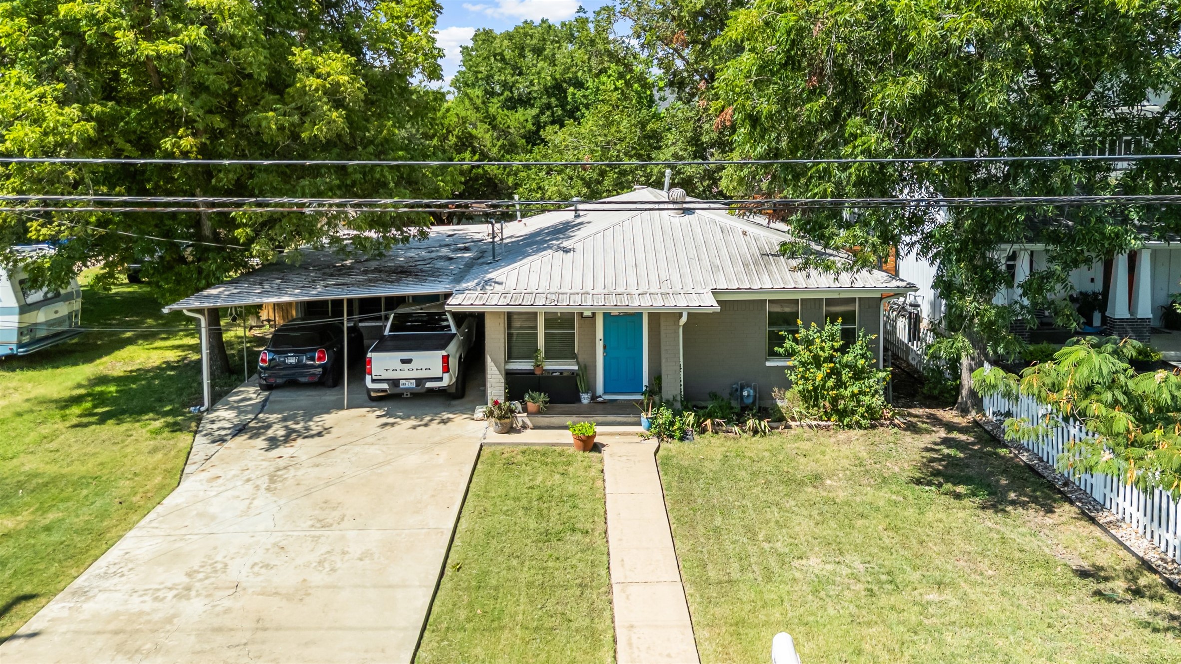 405 West 17th Street Georgetown, TX 78626 - Photo 21 of 21 a front view of a house with a garden and patio