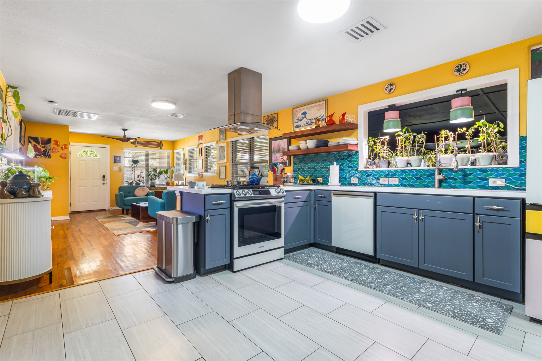 405 West 17th Street Georgetown, TX 78626 - Photo 8 of 21 a kitchen with stainless steel appliances granite countertop a stove and cabinets