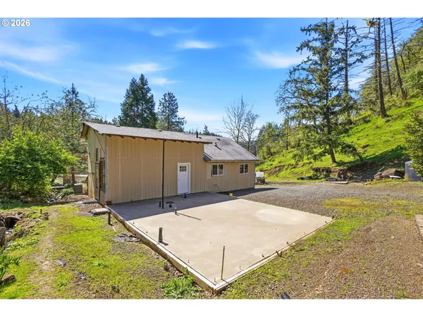 a house view with a backyard space