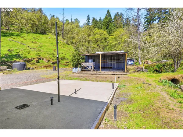 a swimming pool with trees in the background