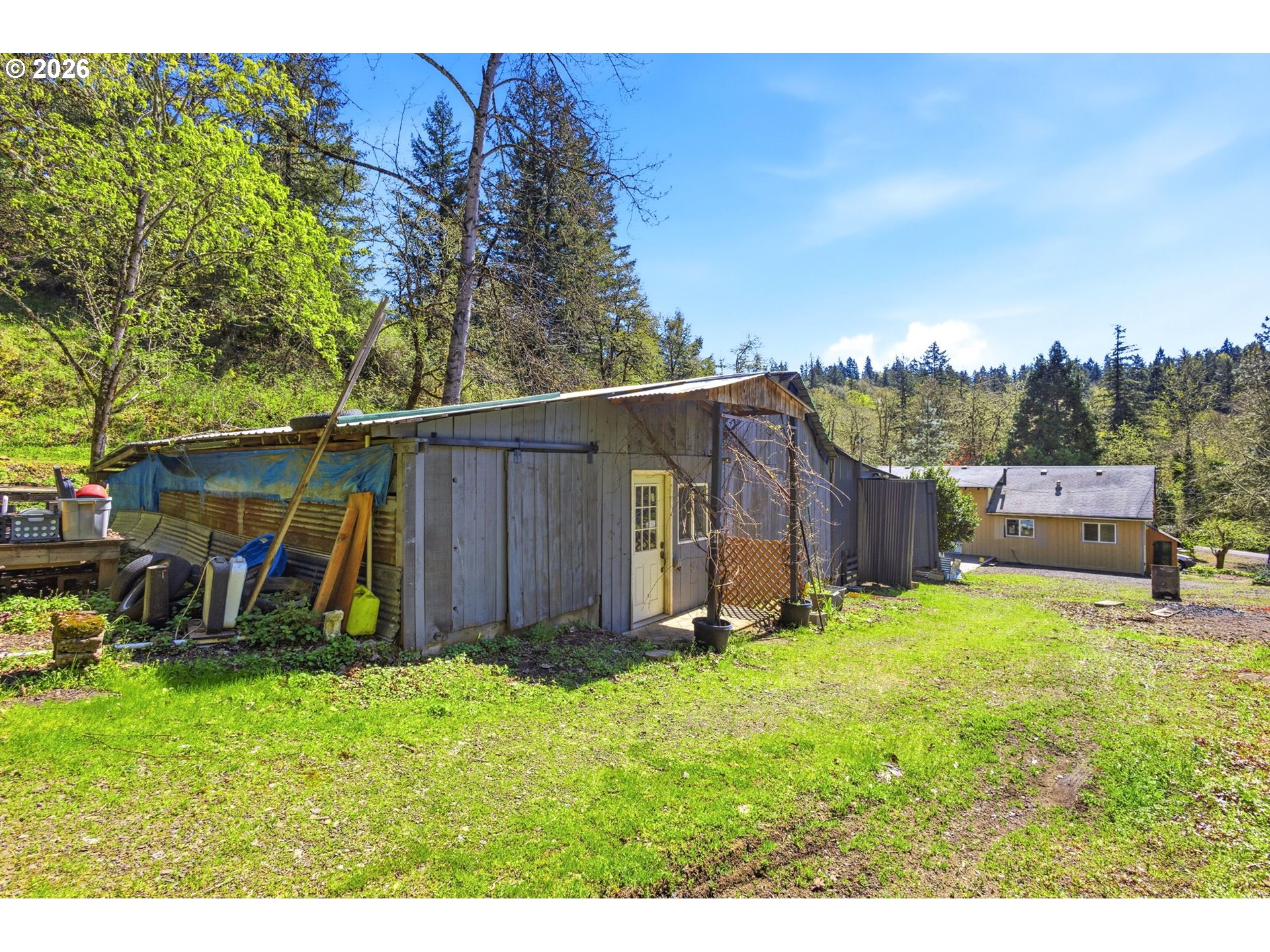 38775 Golden Valley Drive Lebanon, OR 97355 - Photo 21 of 36 a view of backyard with potted plants and a large tree