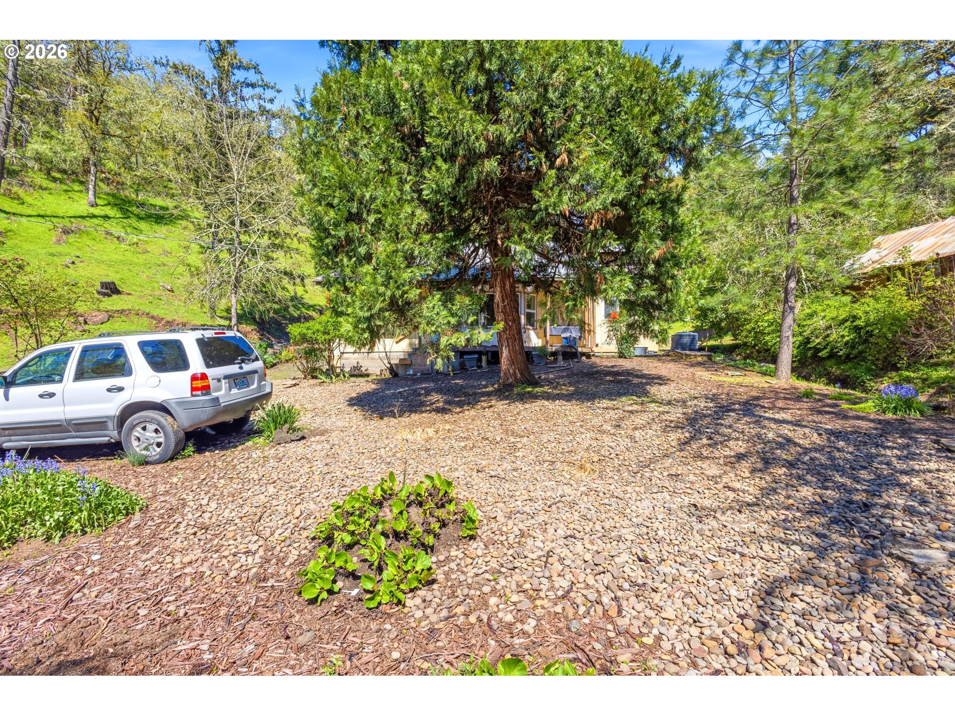 38775 Golden Valley Drive Lebanon, OR 97355 - Photo 22 of 36 a view of a yard with car parked