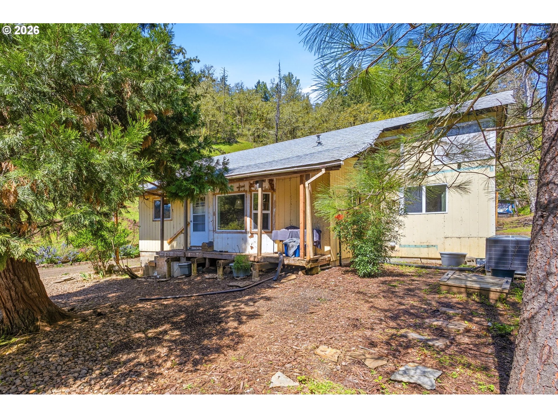 38775 Golden Valley Drive Lebanon, OR 97355 - Photo 23 of 36 a backyard of a house with yard and outdoor seating