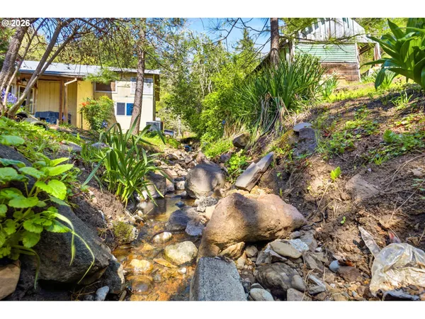 a backyard of a house with lots of green space