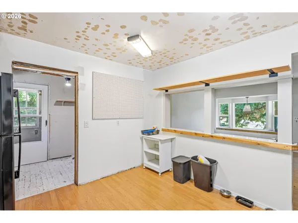 a view of a refrigerator and window
