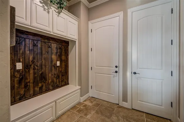a view of a kitchen with white cabinets