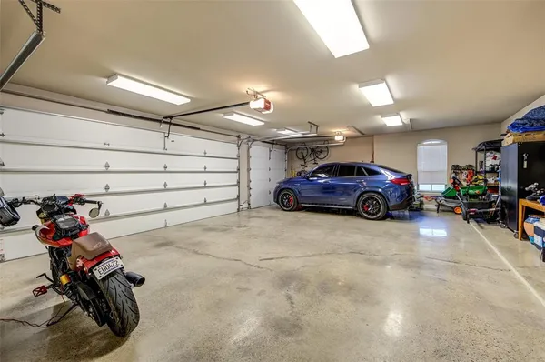 a view of a garage with parked cars