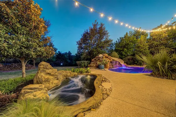 a view of swimming pool with an outdoor space and seating area