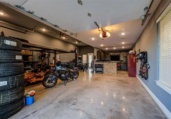a view of a garage with a bike and car