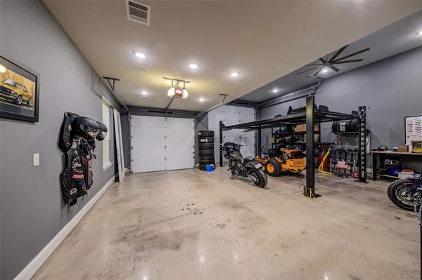 a view of a garage with a bike and car