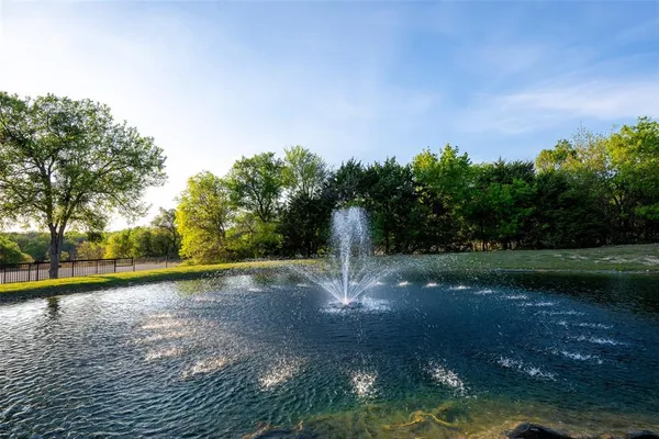 a view of a lake with a yard