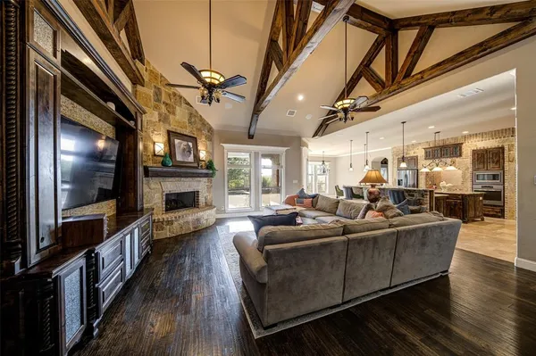 a living room with fireplace furniture and a flat screen tv