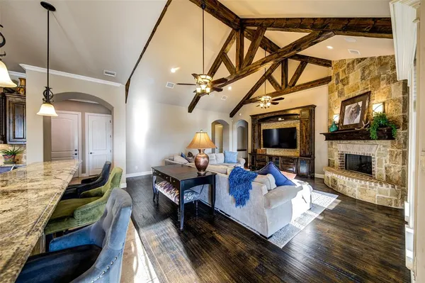a living room with fireplace furniture and a flat screen tv