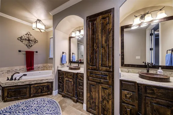 a bathroom with a sink double vanity and a mirror