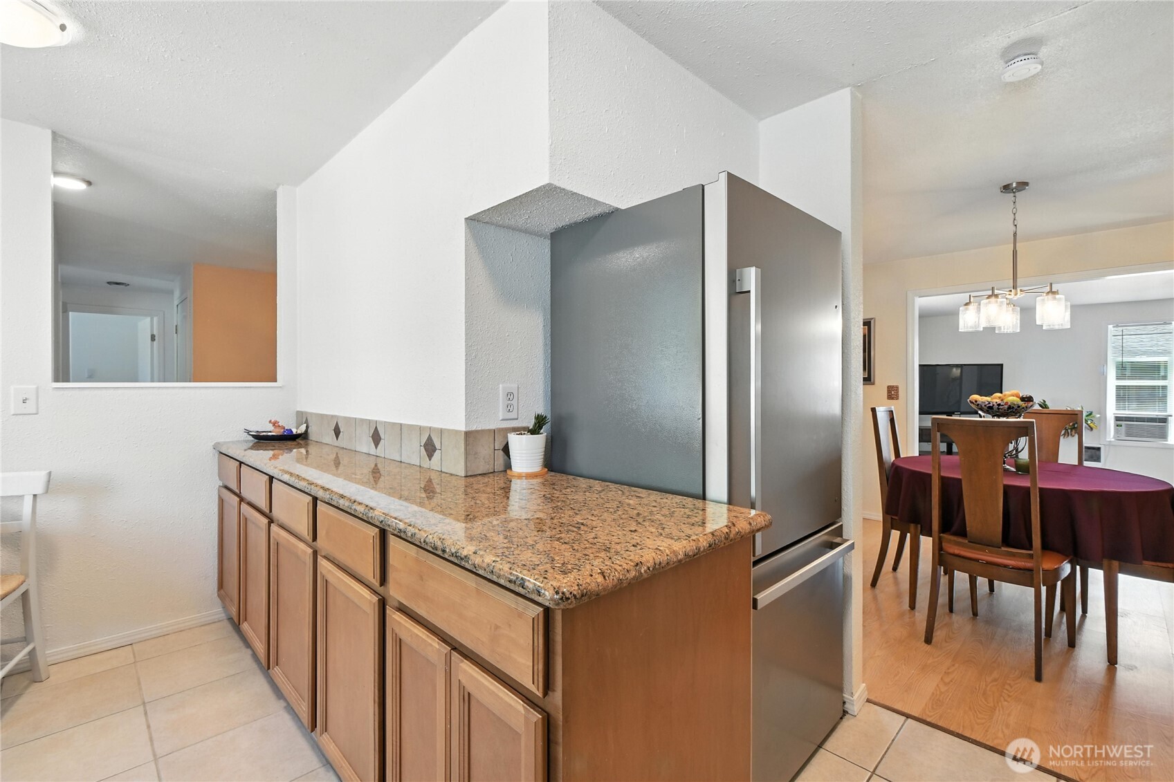 2102 35th Avenue Longview, WA 98632 - Photo 13 of 31 a kitchen with stainless steel appliances granite countertop a sink and a refrigerator