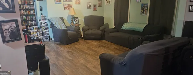 a living room with furniture and a chair