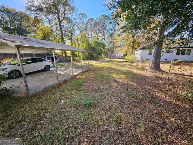 a view of a yard with tree s