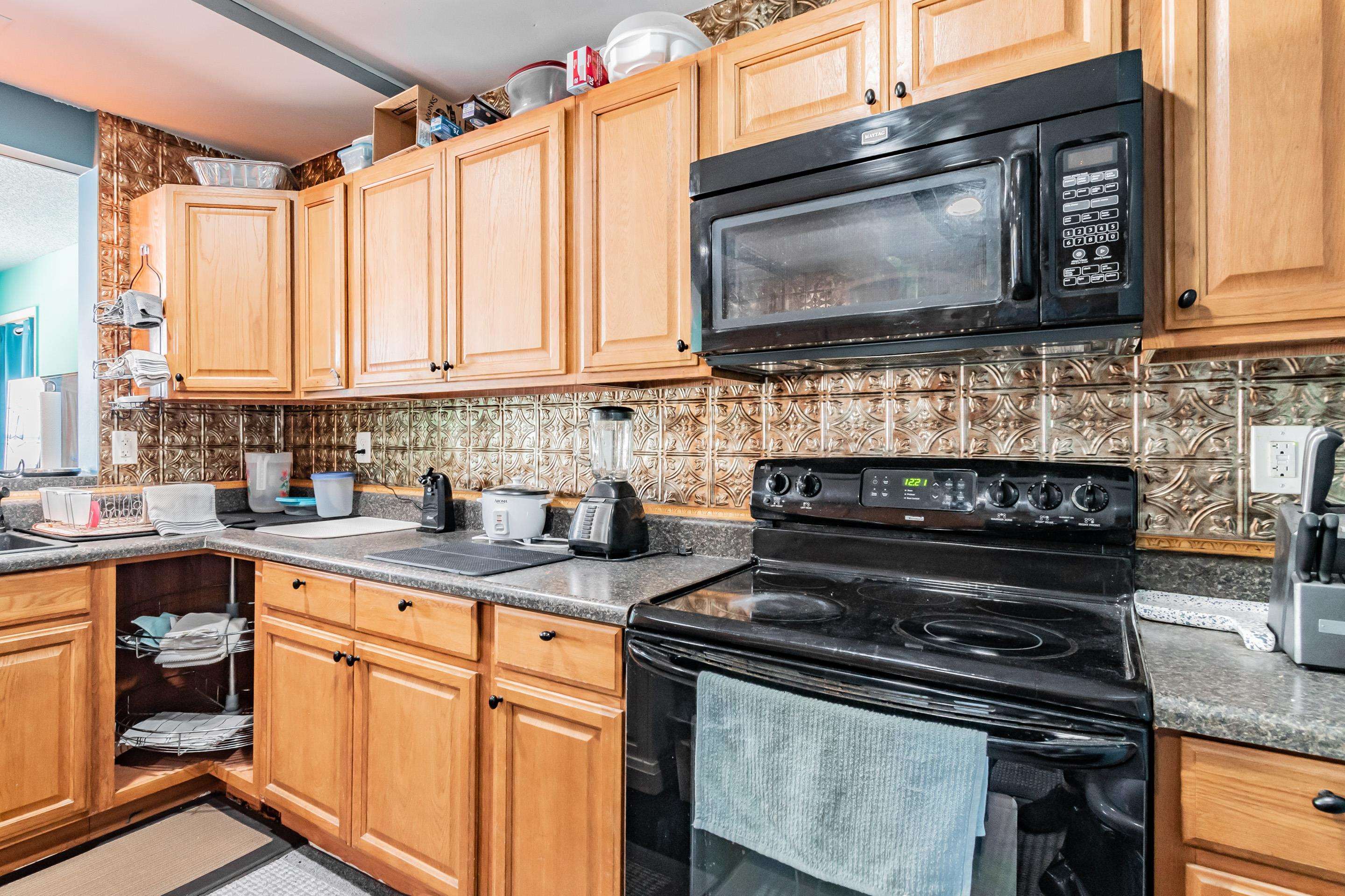238 Cornell Road St. Augustine, FL 32086 - Photo 10 of 33 a kitchen with stainless steel appliances a stove a sink and a microwave