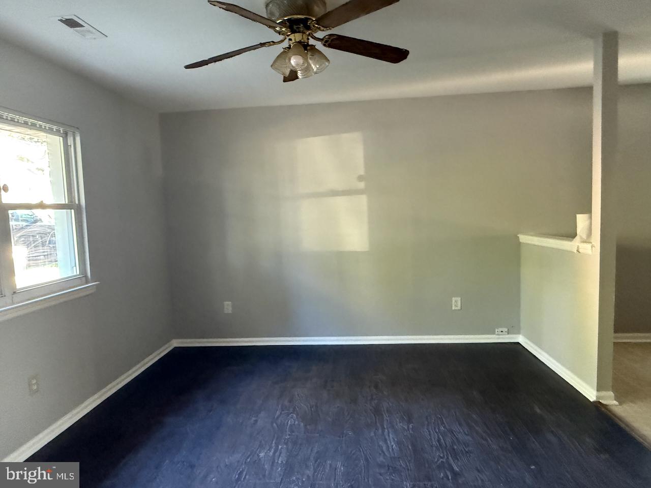 202 Robbins Street Philadelphia, PA 19111 - Photo 12 of 23 an empty room with wooden floor fan and windows