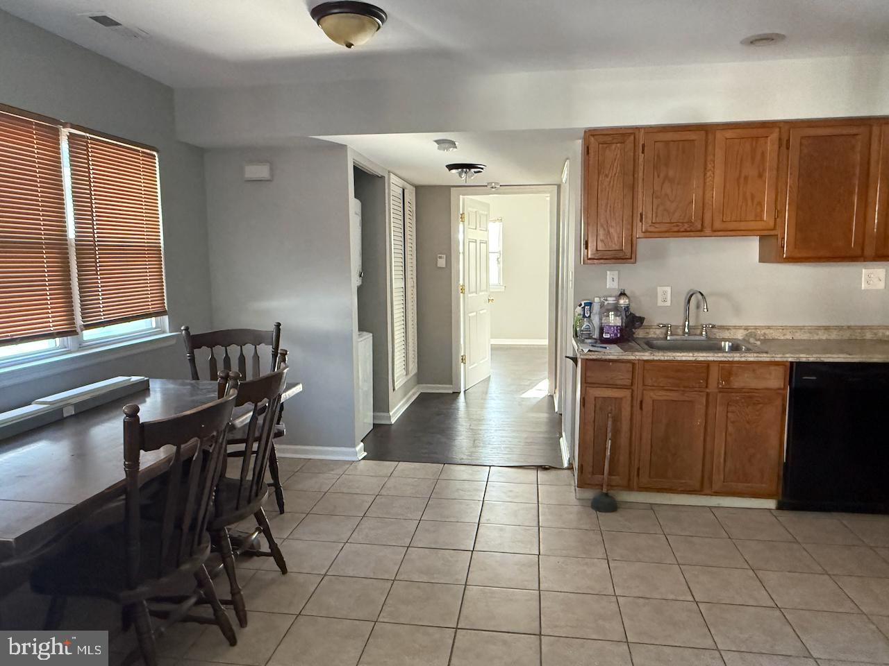 202 Robbins Street Philadelphia, PA 19111 - Photo 21 of 23 a kitchen with a table chairs and a window