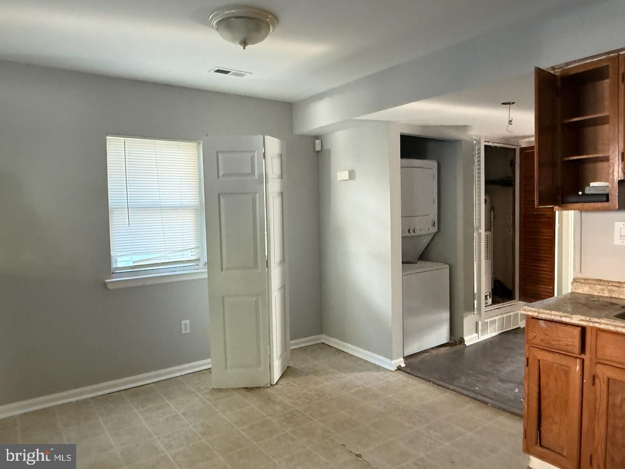 202 Robbins Street Philadelphia, PA 19111 - Photo 4 of 23 an empty room with kitchen and entryway