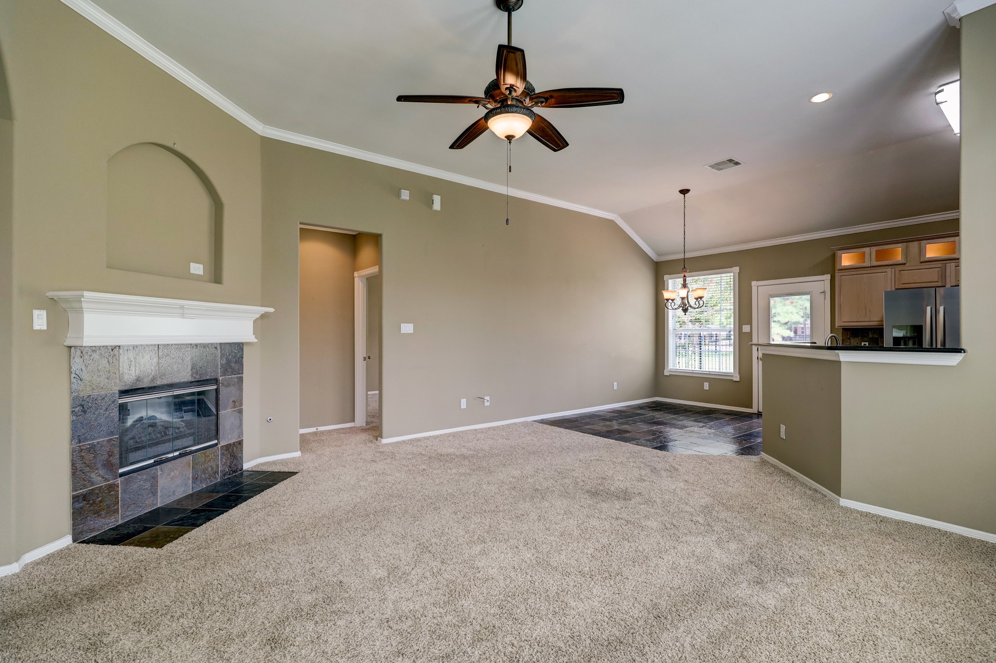 18618 Jaya Loch Court Spring, TX 77379 - Photo 5 of 18 a view of a kitchen with a sink and a fireplace