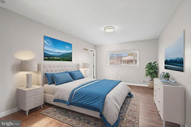 a bedroom with a large bed and a couch