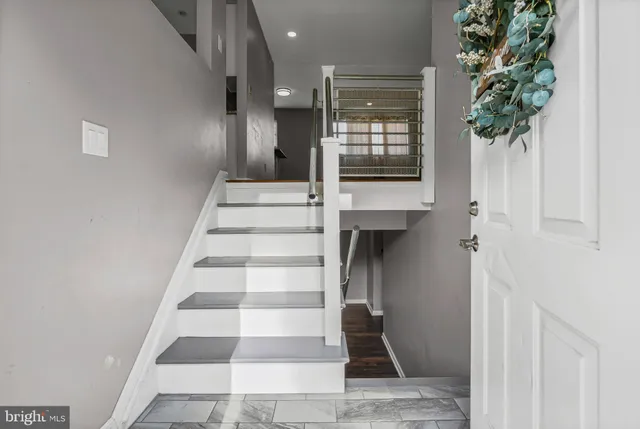 a view of entryway with a front door