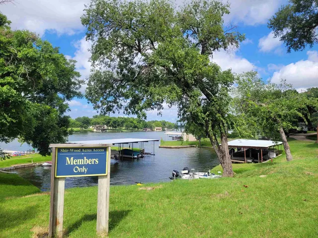 a view of house with river in front of it