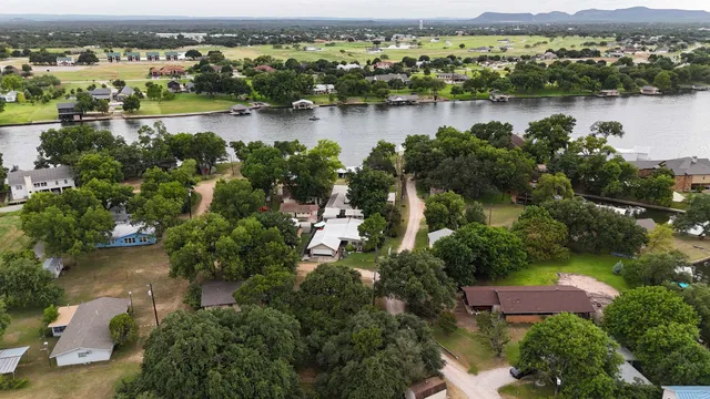 an aerial view of a city with lake view