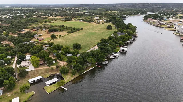 an aerial view of a city with ocean view