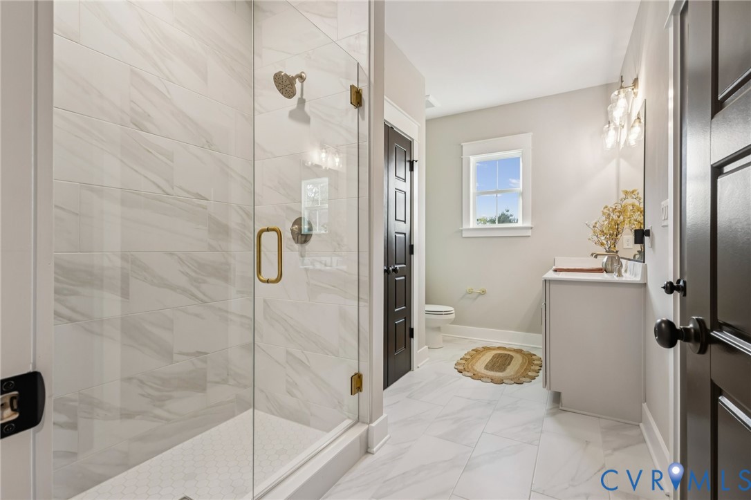 Lot 5 Olivet Church Road New Kent, VA 23124 - Photo 35 of 40 Glass-enclosed shower with gold-tone hardware