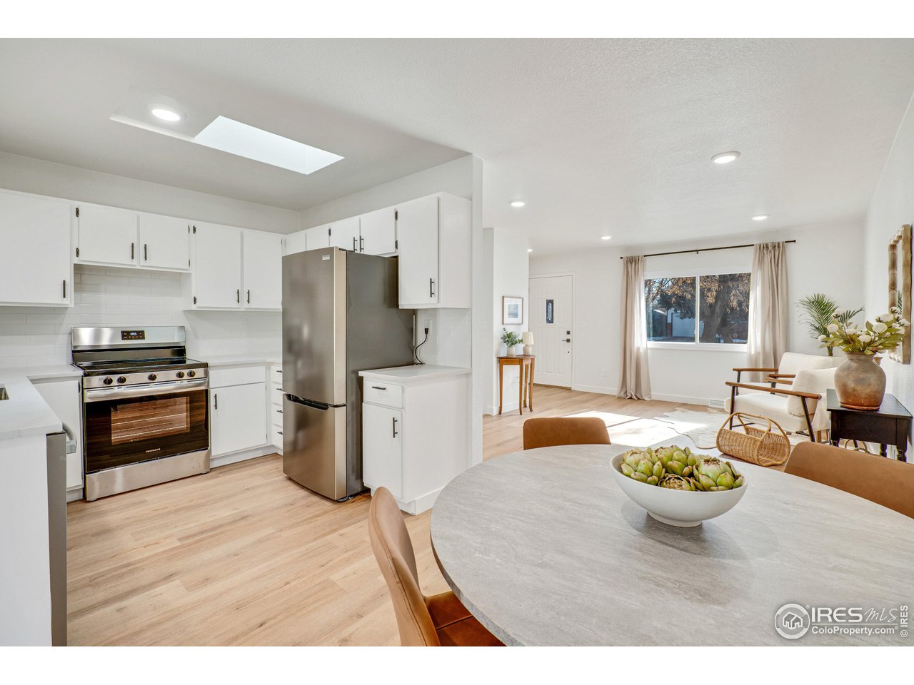 1115 2nd Street Road Eaton, CO 80615 - Photo 11 of 39 a kitchen and a refrigerator in a kitchen