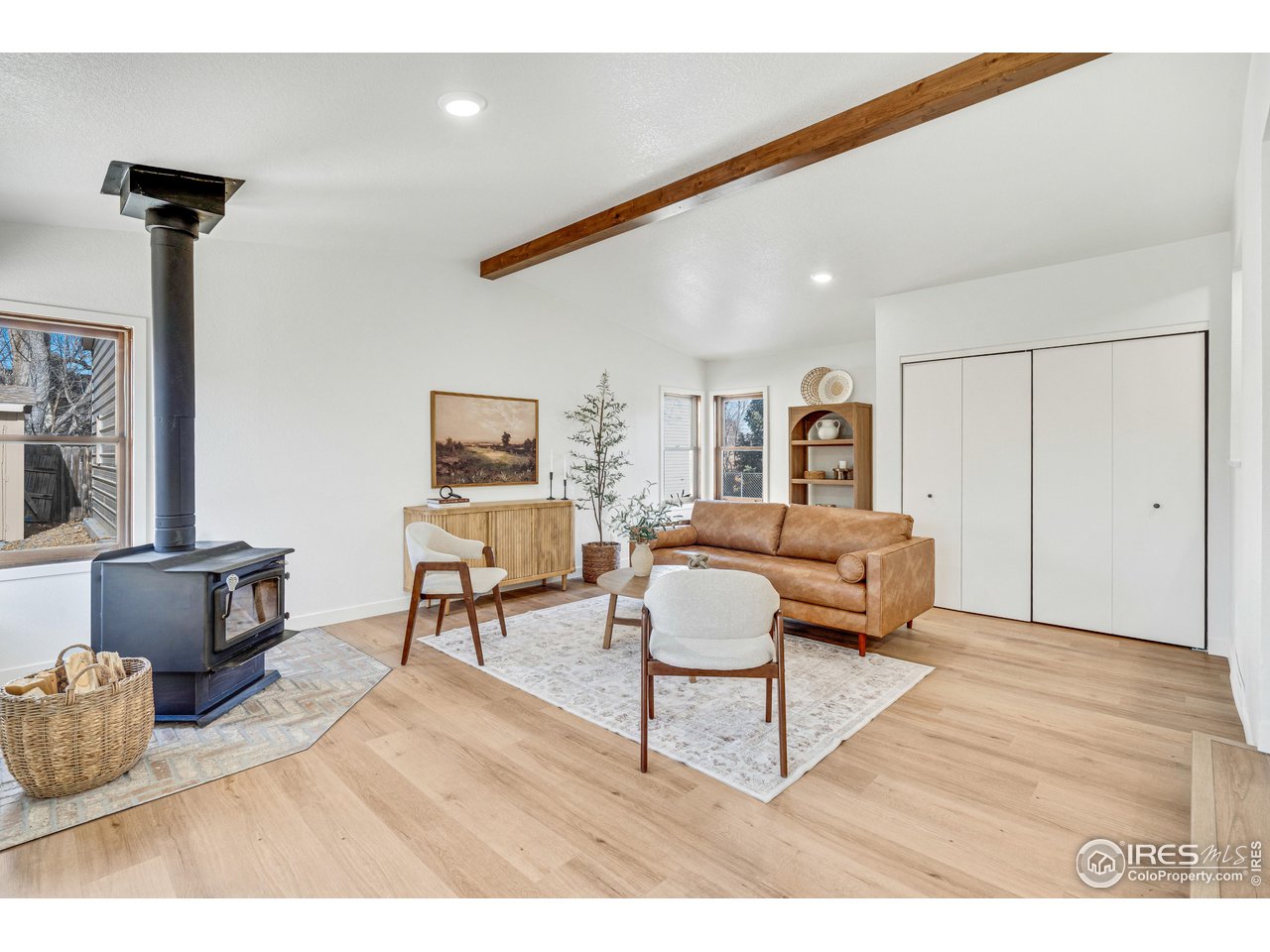 1115 2nd Street Road Eaton, CO 80615 - Photo 15 of 39 a living room with furniture and a wooden floor