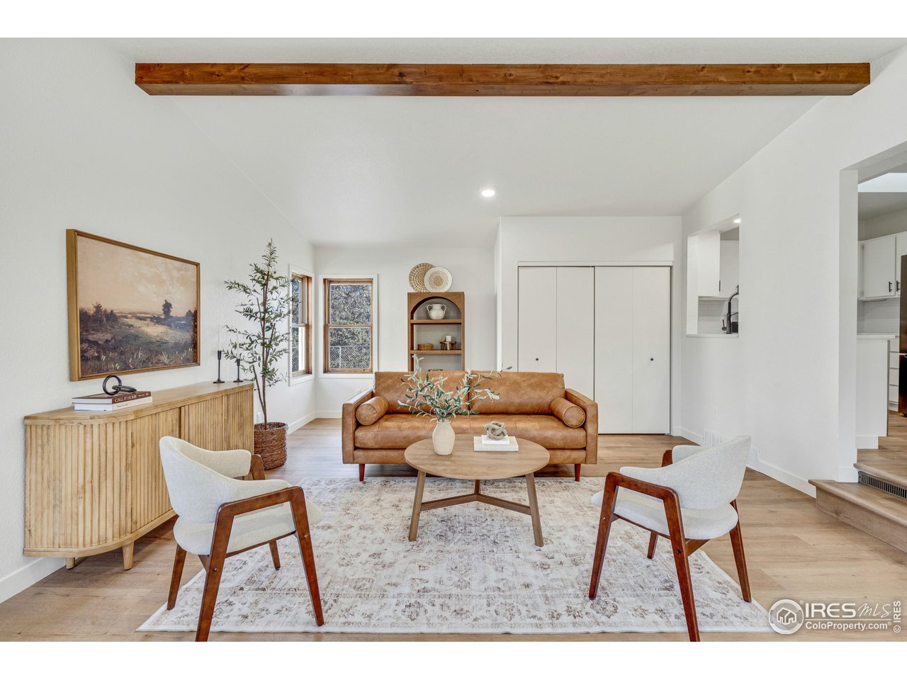 1115 2nd Street Road Eaton, CO 80615 - Photo 16 of 39 a living room with furniture and a flat screen tv