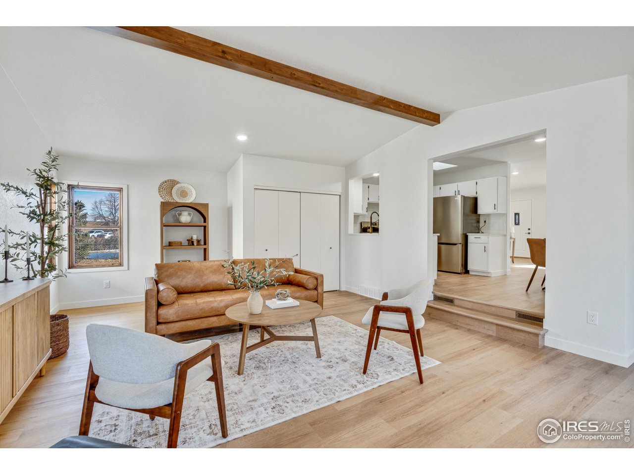1115 2nd Street Road Eaton, CO 80615 - Photo 21 of 39 a living room with furniture and a wooden floor