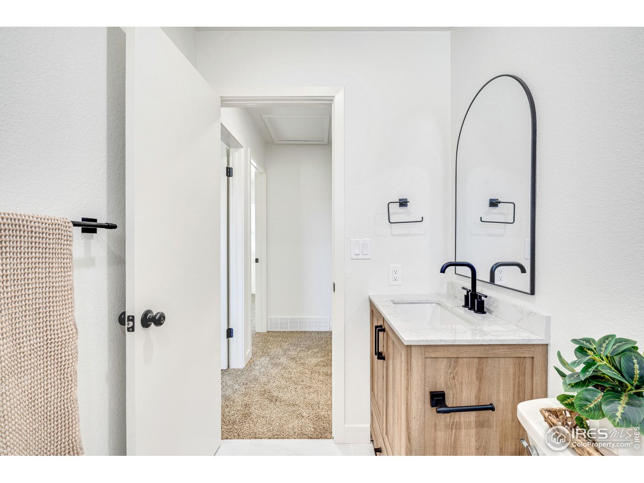 1115 2nd Street Road Eaton, CO 80615 - Photo 22 of 39 a bathroom with a sink and a mirror