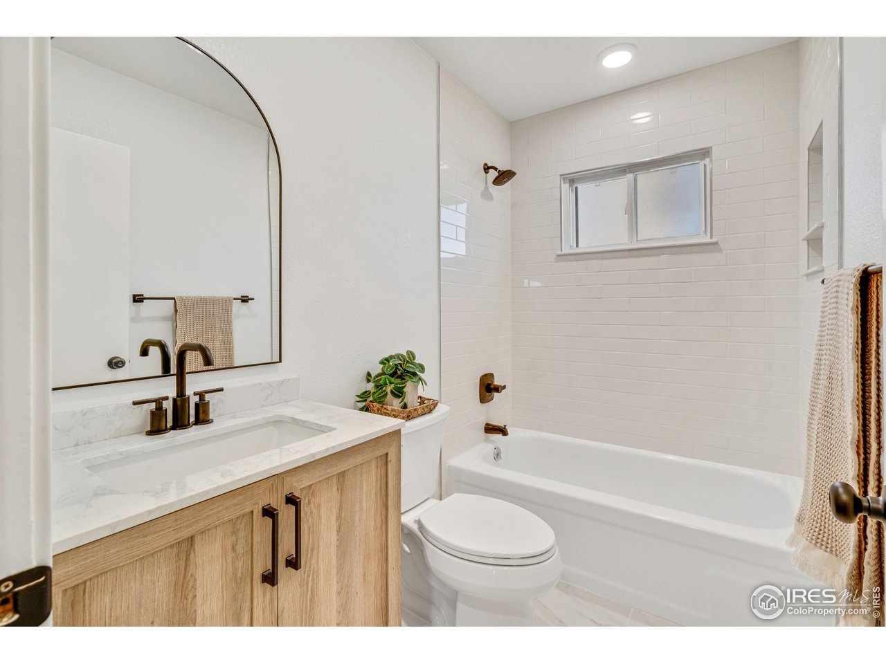 1115 2nd Street Road Eaton, CO 80615 - Photo 24 of 39 a bathroom with a sink a toilet and shower